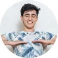 Breathing A smiling male with both his palms facing downwards performing breathing exercise