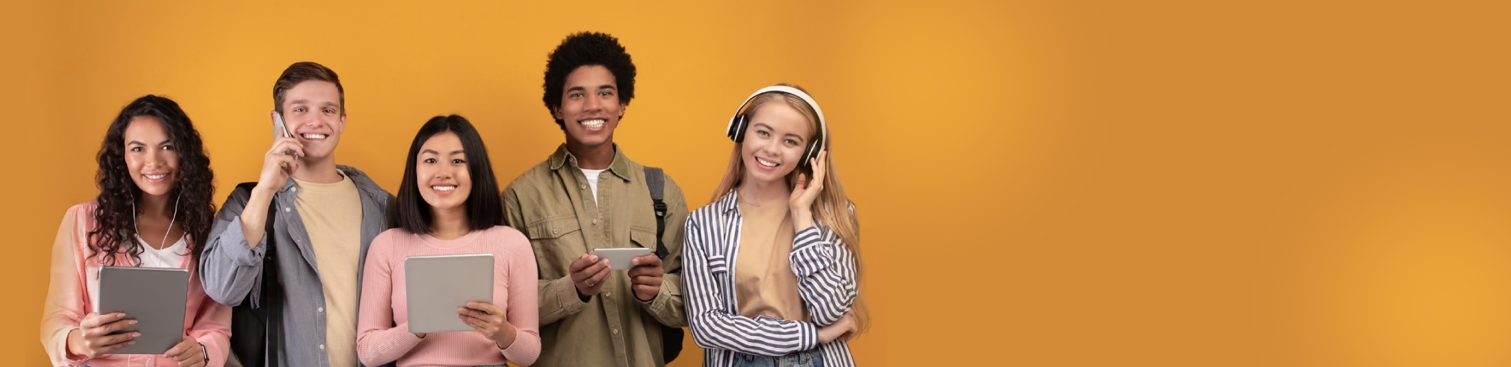 Group of teenagers Group of smiling teenagers against an orange background, capturing the cheerful vibe of a teen workshop.