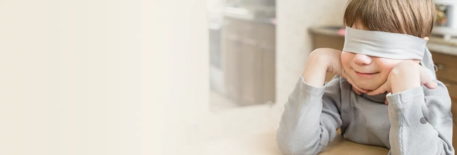 Unleash your potential Child with a blindfold, learning to develop intuitive abilities through the Intuition Process.