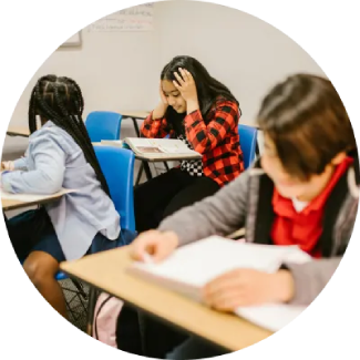 Mental Abilities Students reading at desks in a classroom, creating a focused environment for learning and self-confidence.
