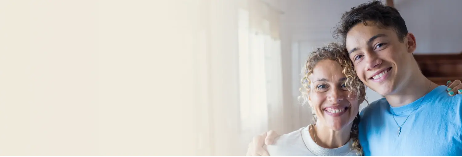 Know Your Teen Workshop - Strengthening Parent-Teen Relationships Mother and teen son smiling together, symbolizing a happy, supportive parent-teen relationship"