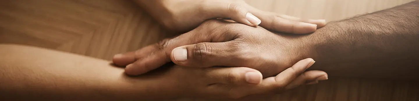 Art of healing through blessings Close-up of two hands holding each other, symbolizing healing through blessings