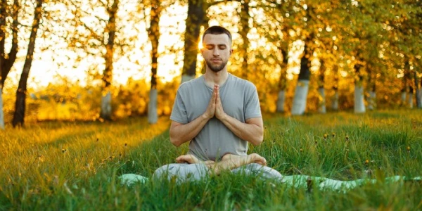 Deeper meditation practice peaceful meditation scene with a man surrounded by greenery
